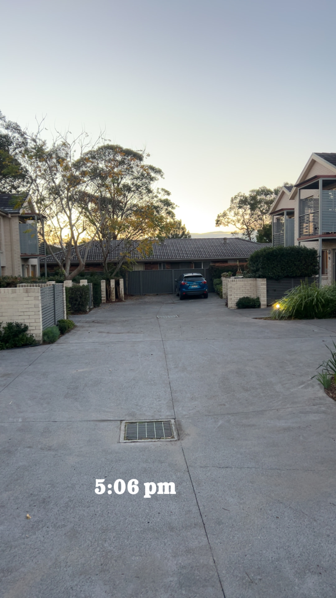 Shared townhouse driveway cleaned to an even light concrete finish