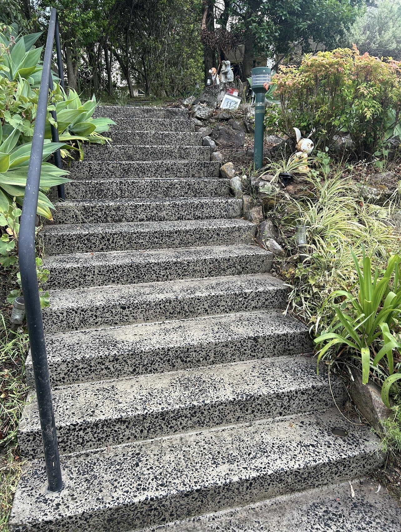 Exposed aggregate steps cleaned back to a crisp black and white stone finish